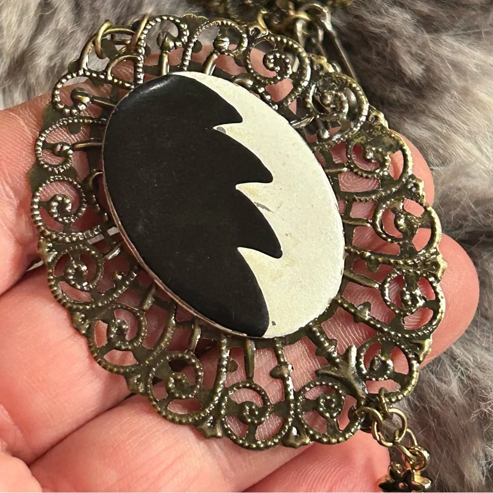 Handcrafted Cruella de Vil cameo bat accent pendant on chain necklace